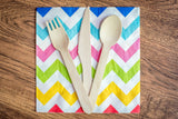 Birch wood fork, knife, and spoon on napkin