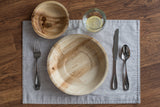 Table setting with palm leaf dishes from above