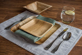 Table setting with palm leaf dishes