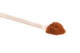 Birch wood spoon and cayenne pepper